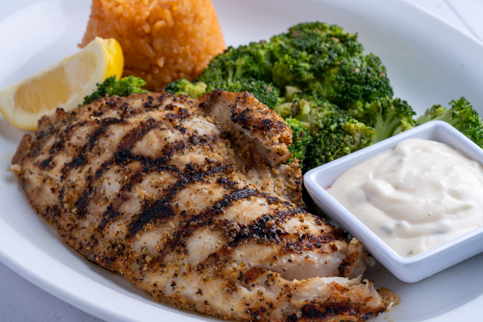 Sami's grilled grouper with broccoli and rice — fresh from Marco Island waters