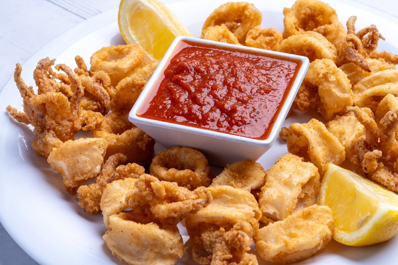Sami's calamari fritti with marinara sauce and lemon